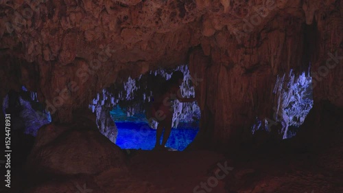 Woman in bikini exploring a cenote cave water 