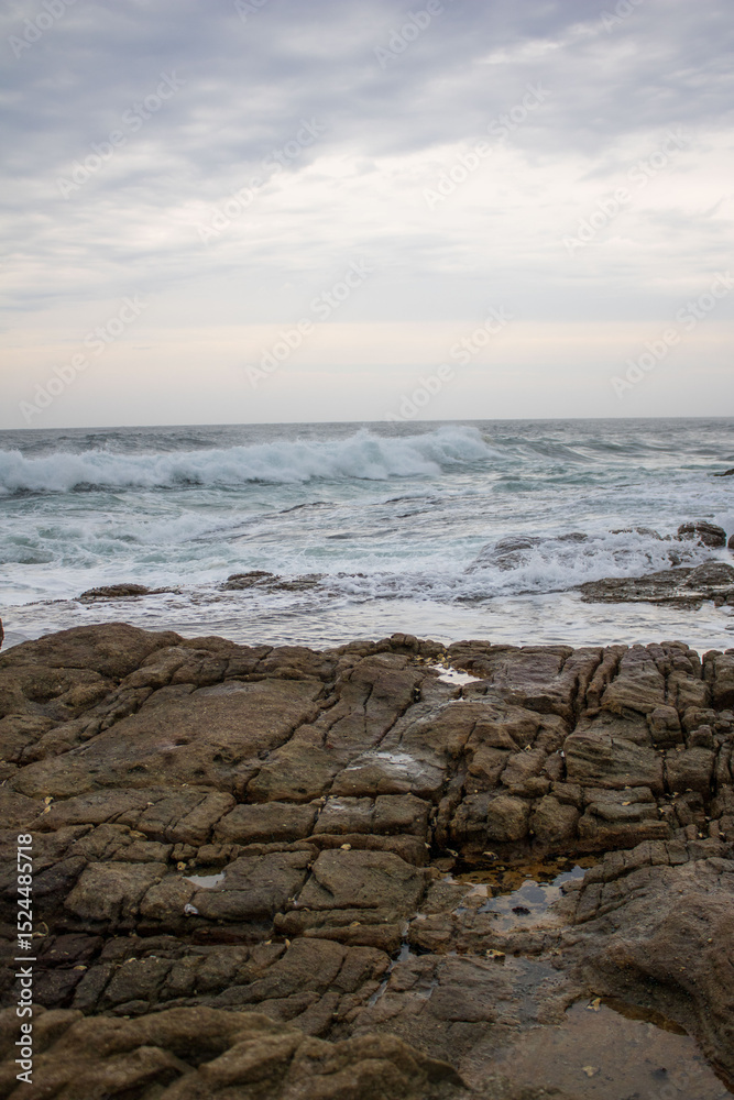 Various waves from the ocean crashing onto the rocks on the south coast of South Africa, located at Orange Rocks in Uvongo in Margate Various waves from the ocean crashing onto the rocks on the south coast of South Africa, located at Orange Rocks in Uvongo in Margate