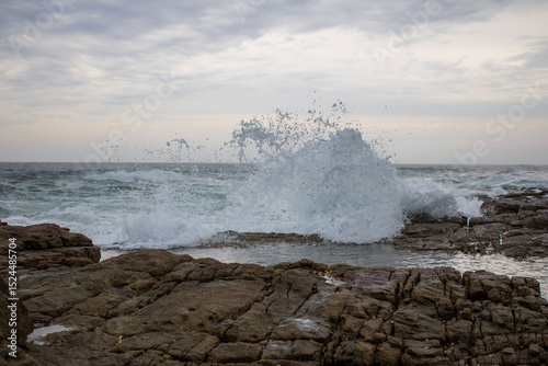 Fototapeta Naklejka Na Ścianę i Meble -  Various waves from the ocean crashing onto the rocks on the south coast of South Africa, located at Orange Rocks in Uvongo in Margate