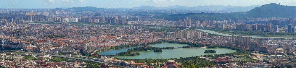 Fototapeta premium Quanzhou city aerial view including historic Licheng district and Xihu (West Lake) Park, from top of Mount Qingyuan, Quanzhou, Fujian Province, China. 