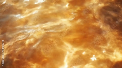 An abstract close-up of shimmering, golden waves in warm tones, creating a tranquil yet dynamic atmosphere.
