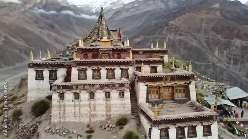 Majestic Tibetan monastery perched on a mountainside, surrounded by serene valleys and peaks at dusk.