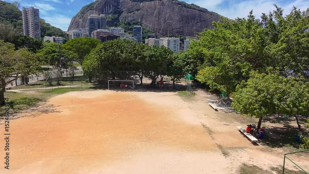 view of the dirt football pitch at Lagoa Rodrigo de Freitas in Rio de Janeiro.