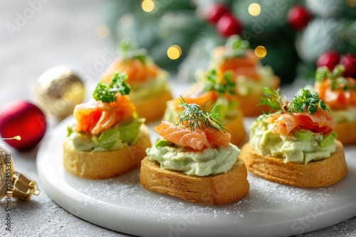 Festive canapés with salmon and avocado cream cheese on a light backdrop featuring Christmas decor Ideas for holiday appetizers for New Year s and Christmas