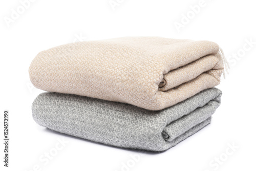 Two folded woolen blankets isolated on white