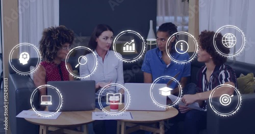 Mid-adult woman gesturing to start project planning, colleagues watching icons aligning over table