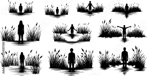 Silhouette of person standing in water with grass