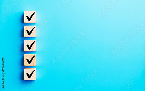 Checklist Icon on Blue Background: Five wooden blocks with check marks aligned on the left against a vibrant blue background. This minimalist graphic suggests completion, planning, and order. 