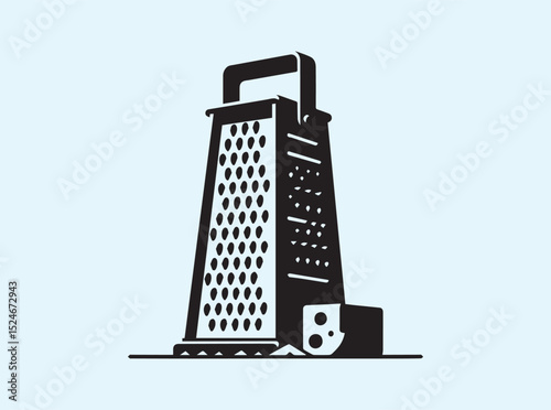 Cheese Grater and Cheese Block on Clean Surface