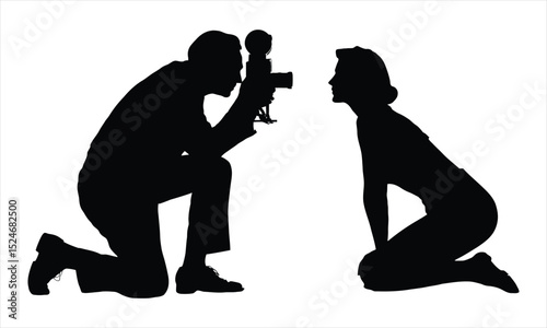 Photographer kneeling captures model silhouette
