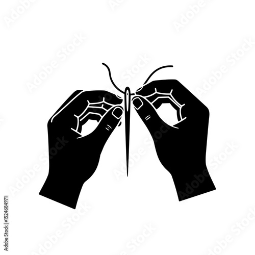Hands threading a needle in a tailor atelier sewing boutique concept  