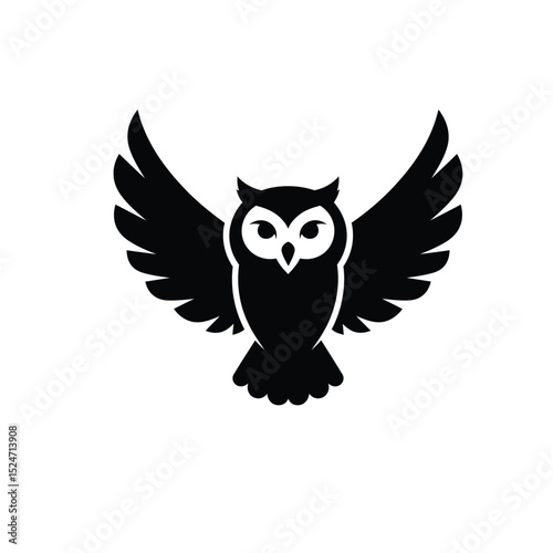 Black silhouette of an owl in flight
