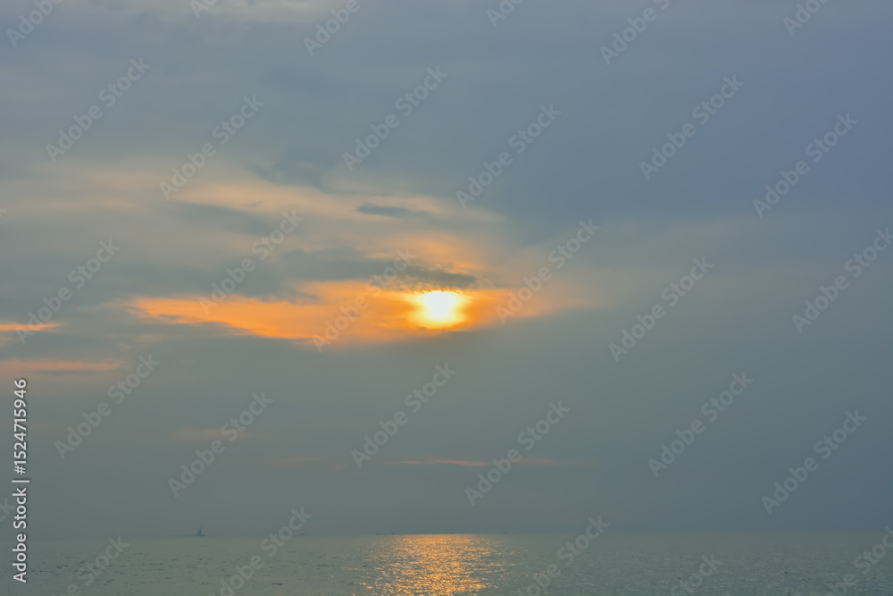 Fototapeta premium Stunning tropical beach at sunset with calm sea and colorful sky, perfect for summer background or travel themes