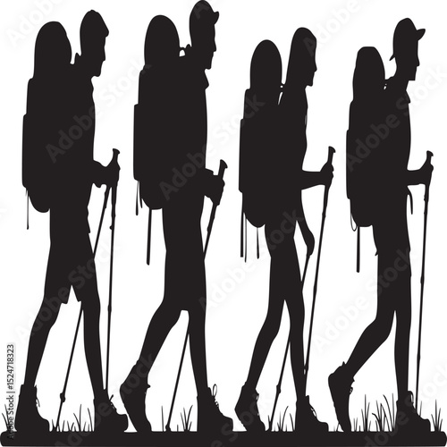 Silhouette of four hikers with backpacks and hiking poles walking in a line on grass field