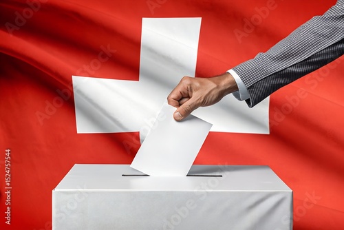 Hand Inserting Paper Ballot in Box with Switzerland National Flag in Background