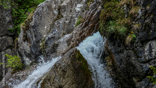 Switzerland, Meiringen, a large waterfall over a rocky cliff