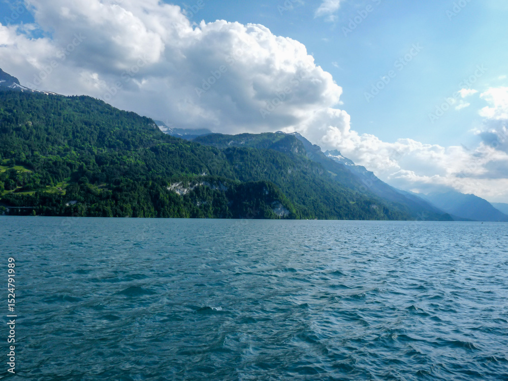 Obraz premium Switzerland, Meiringen, a large body of water with a mountain in the background