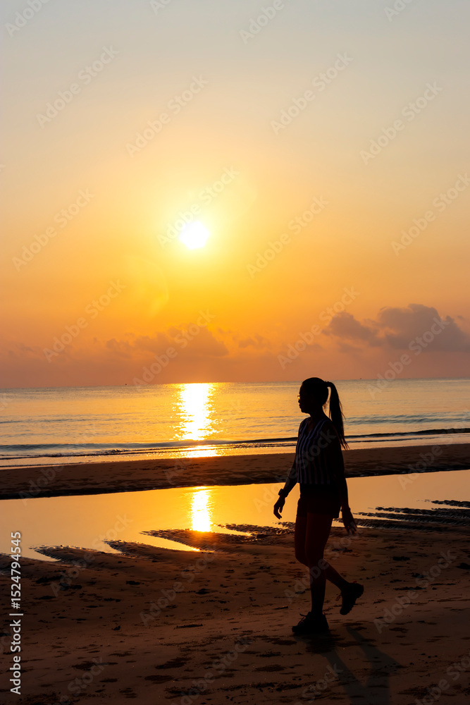 Fototapeta premium Sunrise and silhouette of traveler