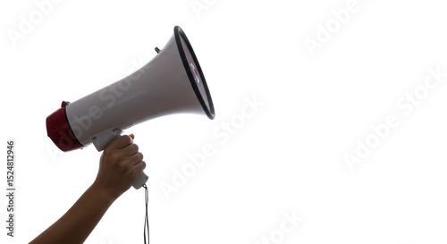 Person holding a white and red megaphone against a black background to amplify their voice clearly. photo