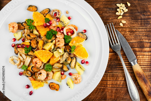 Spicy seafood salad with fruits.