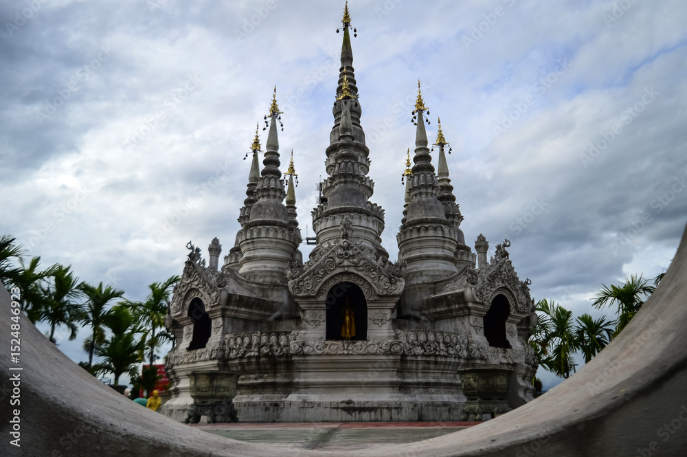 Fototapeta premium Pagoda in evening, Lanna Architecture, Symbols of Buddhism, South East Asia at Phra That Wisutthiyan Temple (Trailaksanaram Forest Temple) Doi saket, Chiang Mai, Northern Thailand