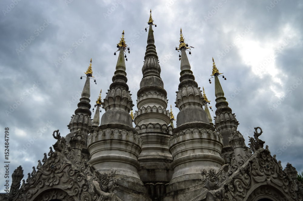 Fototapeta premium Pagoda in evening, Lanna Architecture, Symbols of Buddhism, South East Asia at Phra That Wisutthiyan Temple (Trailaksanaram Forest Temple) Doi saket, Chiang Mai, Northern Thailand