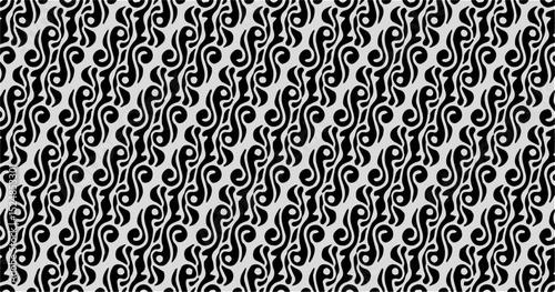 Seamless traditional batik pattern in black and white with rhythmic curves and flowing ornamental shapes.