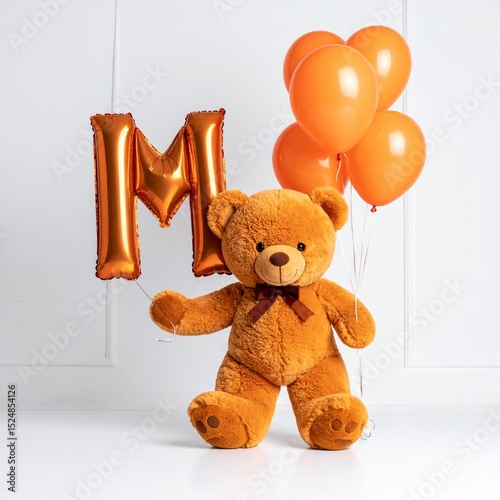 Cute orange teddy bear with balloon letter M. Baby name reveal after child birth. Stuffed animal isolated on white background