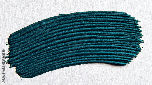 Teal textured paint stroke on white paper showcases vibrant color and brushstroke detail closeup