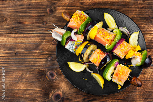 Fresh salmon skewers with vegetables.