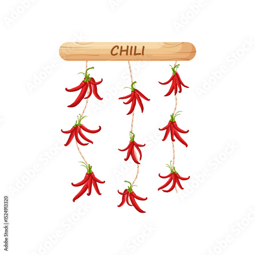Red, hot, chili pepper. Pepper is tied on a rope, on a wooden stick, drying.
