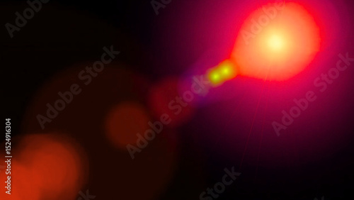 Red and orange lens flare light bokeh effect glow dark background abstract photography digital art image vibrant colors radiant energy