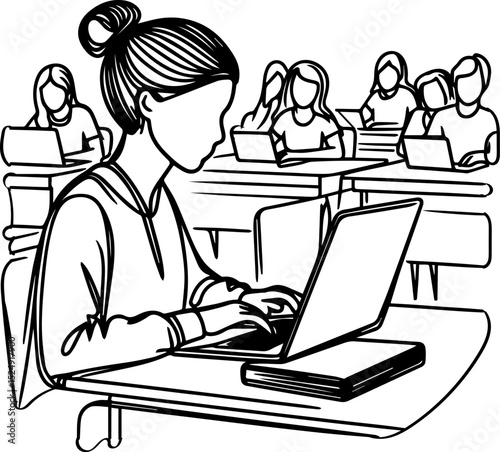 Young student typing on laptop in classroom during lesson