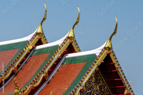 Roof design of a Thai building. Three layered wooden and clay tiles are used for sloping roofs in Thailand. 