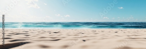 Calm Beach With Fine Sand and Clear Blue Water During Midday Under a Bright Sky.