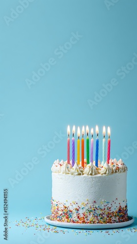 Celebration Cake With Colorful Candles and Sprinkles Prepared for a Joyful Ev...