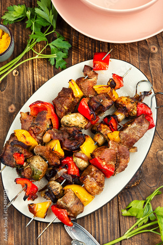 Meat skewers or kebabs, barbecued.