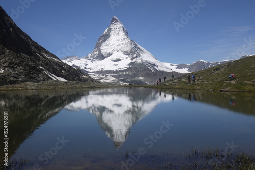 reflection of the Matterhorn mountain on the surface of Riffelsee in the summer, Switzerland