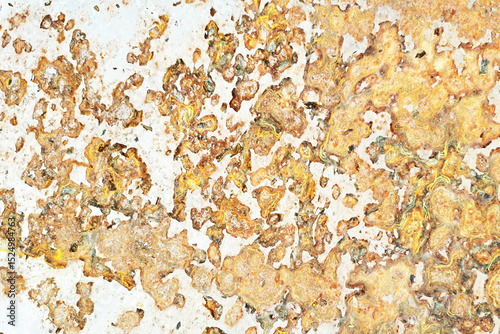 Corroded metal texture background. Rust and oxidation surface. Old decayed steel plate with peeling paint. Industrial damage pattern. Flaky orange corrosion on white metallic material.