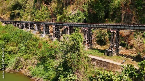 Aerial view of historical death railway bridge over the river kwai in Kanchanaburi, Thailand.