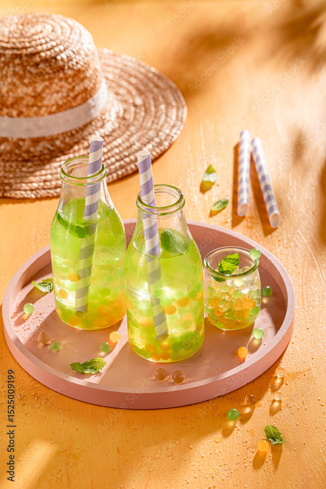 Obraz premium Tasty bubble tea made of juice, fruits and pearls.