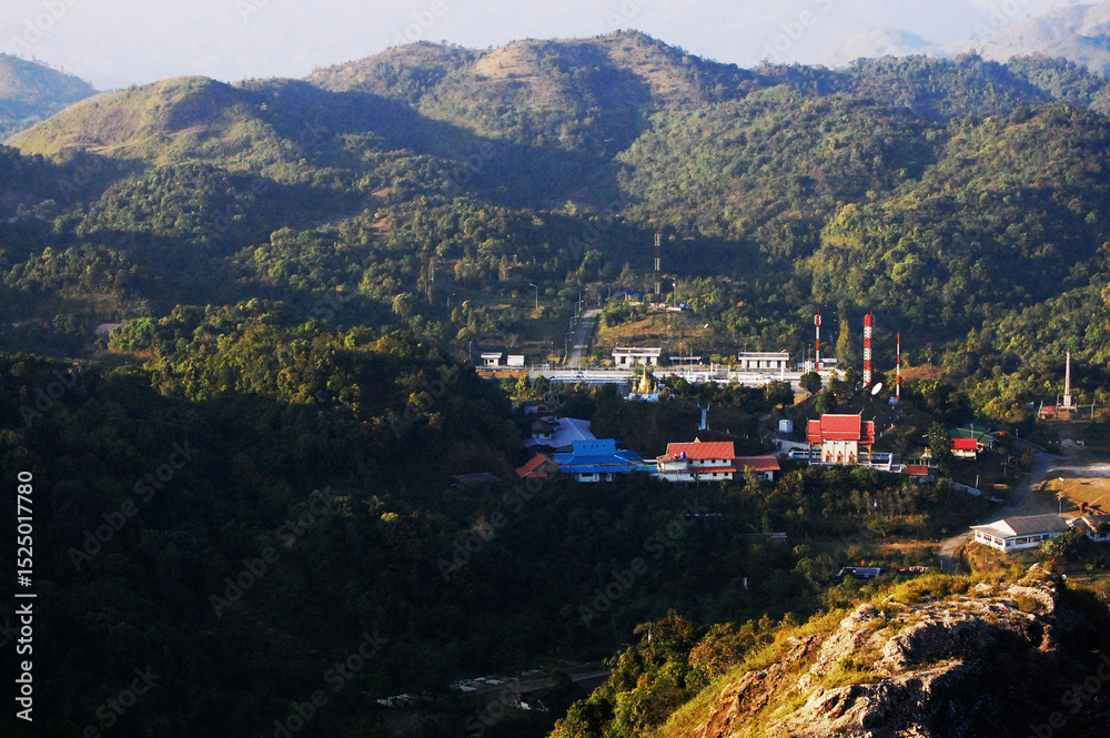 Obraz premium Aerial view landscape forest mountain of Thong Pha Phum national park at Pilok hill valley and cityscape of E Tong local village for thai people travelers travel visit rest in Kanchanaburi, Thailand