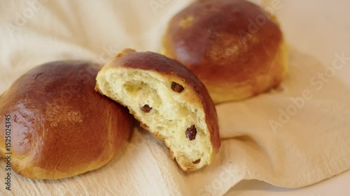 Removing Hot Raisin Buns from Oven and Cooling on Rack