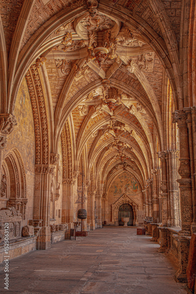 Fototapeta premium Ancient Spanish Soria stone cloister with rustic walls, historic arches, and medieval architecture. Heritage site imagery for travel, history and cultural projects. High-quality photography showcas