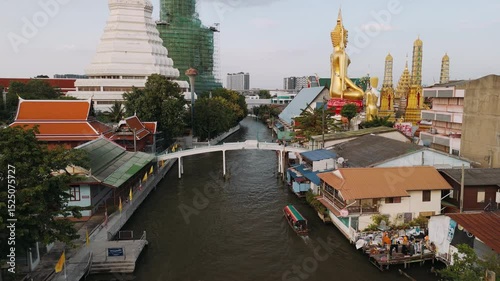 Aerial view of wat paknam phasi charoen temple and surrounding urban area in Bangkok, Thailand.
