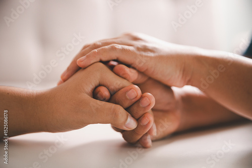 Hope and trust with crisis concept. Closeup, love and holding hands for support, comfort and care with grief, loss and empathy. people and family with compassion, sympathy and healing with bonding.