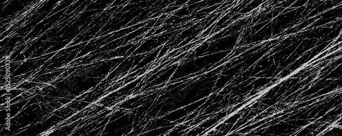 Abstract black and white texture with streaks resembling scratched surfaces in an artistic layout