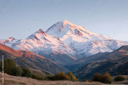 majestic elbrus mountain bathed in warm glow of sunset surrounded by serene landscapes