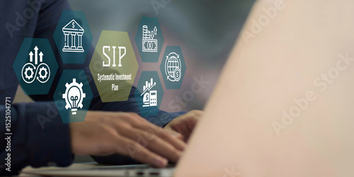 A business person using laptop with SIP Systematic Investment Plan concept.