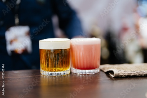 Craft beverages showcased on a wooden bar during a lively festival event